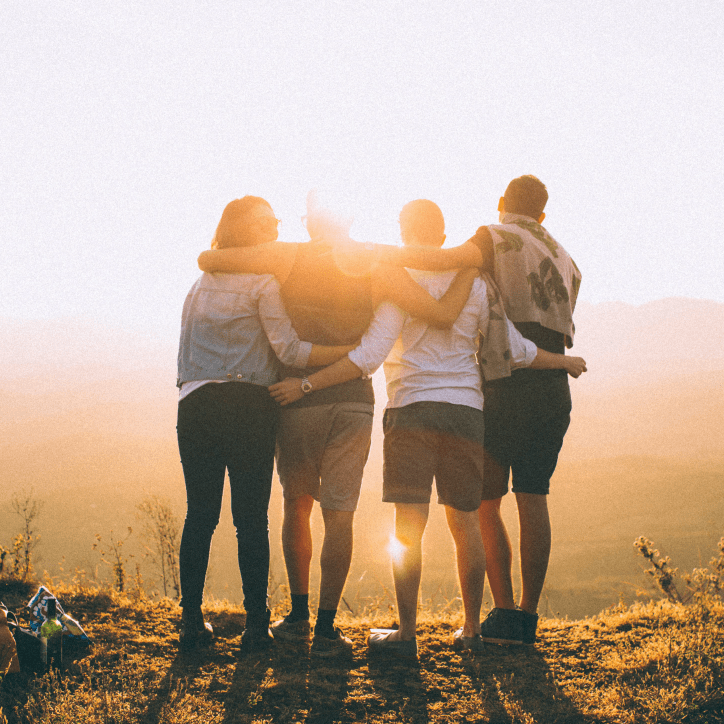 Photo of people at sunset